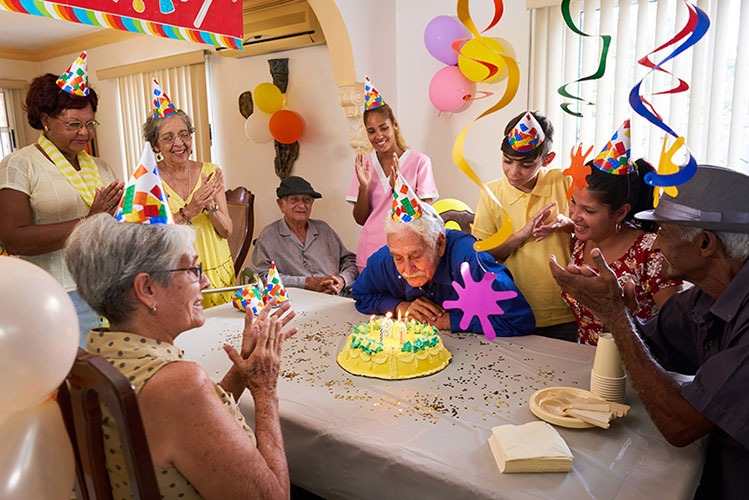 Residents and staff enjoying a cheerful birthday celebration together