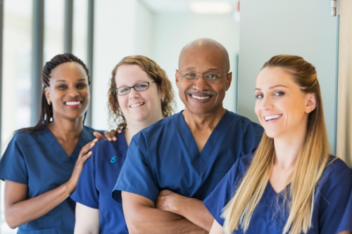 Four nurses working together at a nursing facility in Shreveport, LA