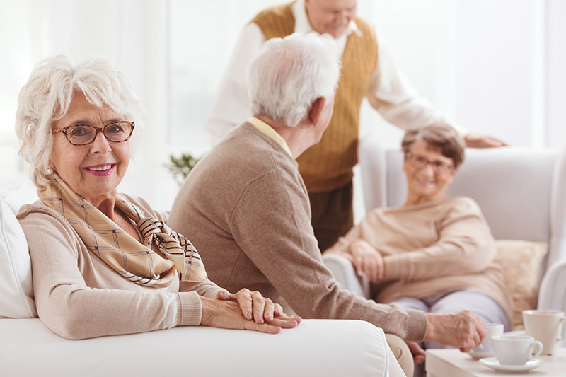 Seniors having tea and chatting at a skilled nursing facility in Shreveport, LA