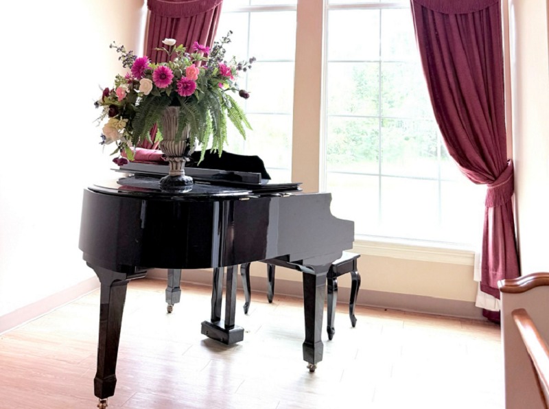 A piano sits by curtained windows where little details make a big difference in Shreveport, LA
