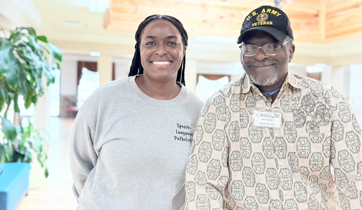 A smiling man and woman arrived at the lobby for a tour in Shreveport, LA